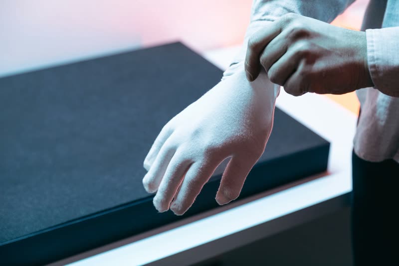Putting on the cotton gloves